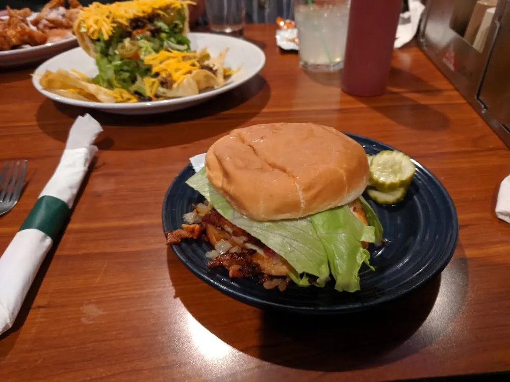 Chicken Breast Sandwich with Tomato Lettuce Grilled Onion Bacon and Mayo